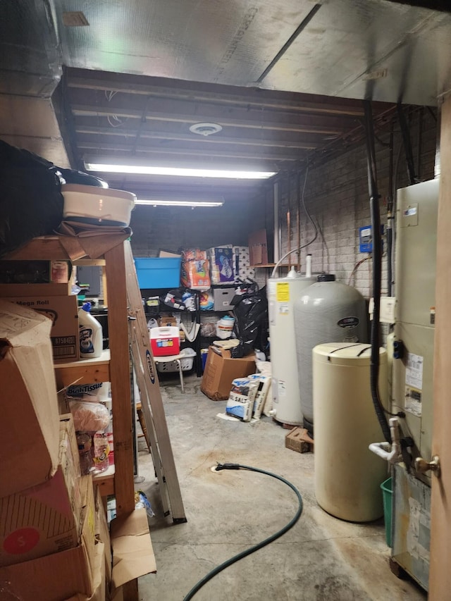 basement with gas water heater and water heater