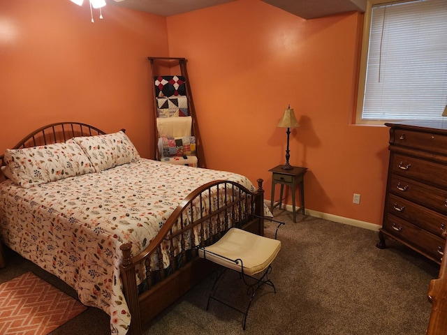 bedroom featuring dark carpet