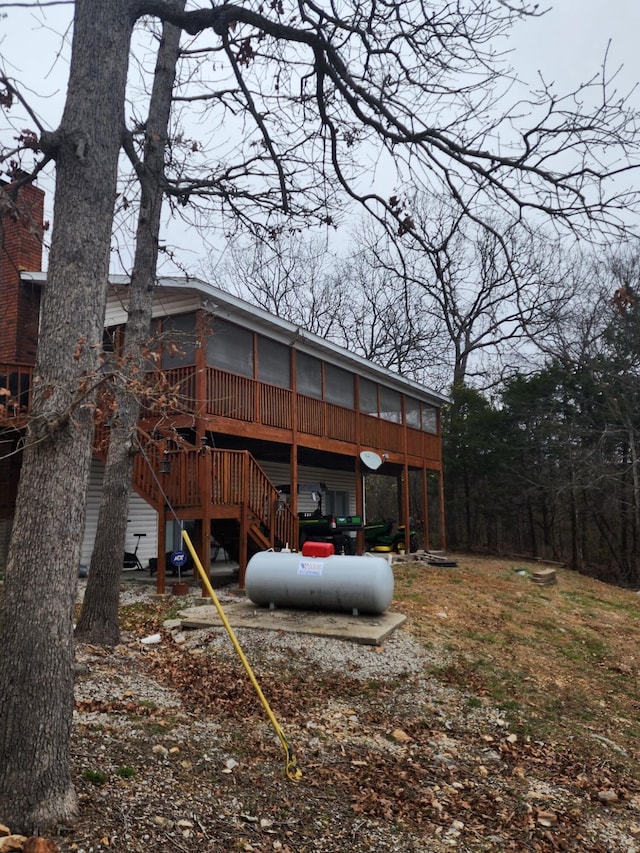 back of house featuring a deck