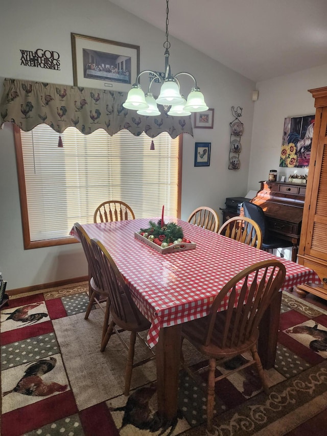 dining room featuring vaulted ceiling