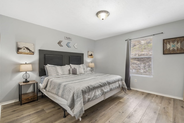 bedroom with wood-type flooring