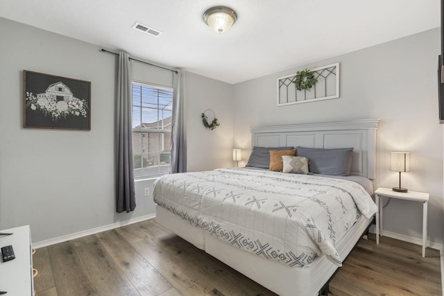 bedroom featuring dark hardwood / wood-style floors