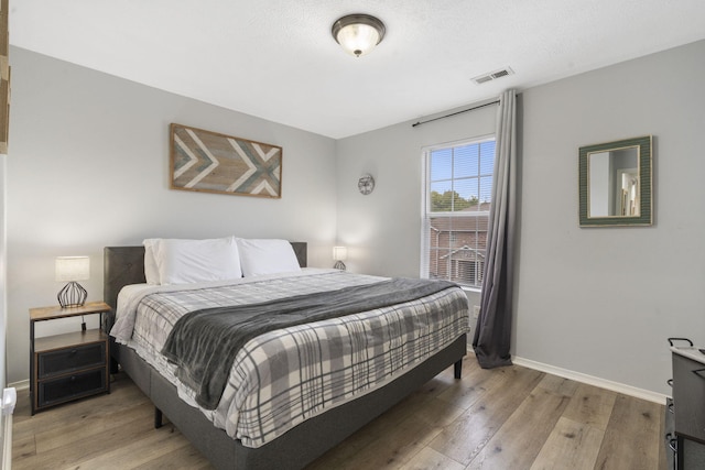 bedroom featuring hardwood / wood-style flooring