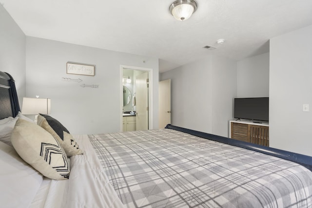 bedroom featuring ensuite bath