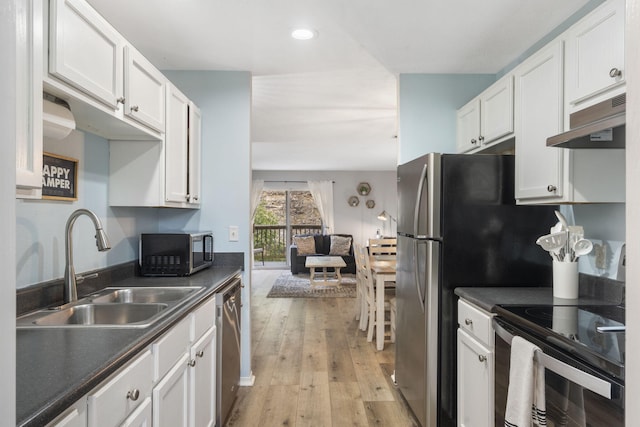 kitchen featuring white cabinets, sink, and appliances with stainless steel finishes