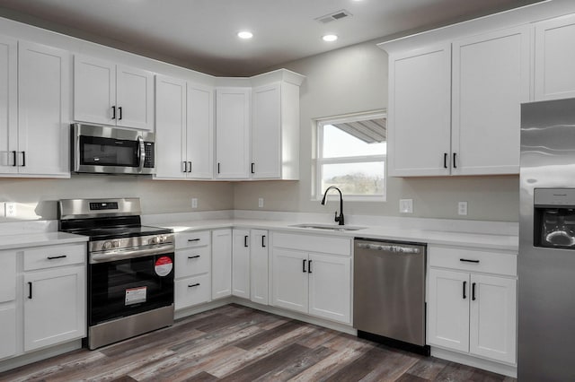 kitchen with white cabinetry, sink, and appliances with stainless steel finishes