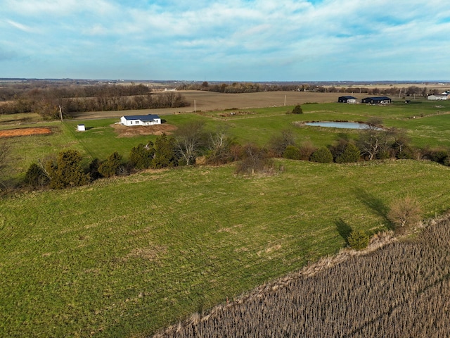 drone / aerial view with a rural view and a water view