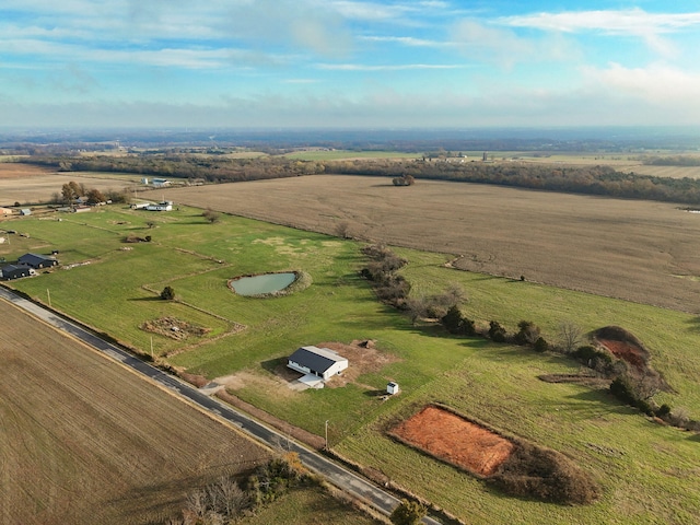 birds eye view of property with a rural view