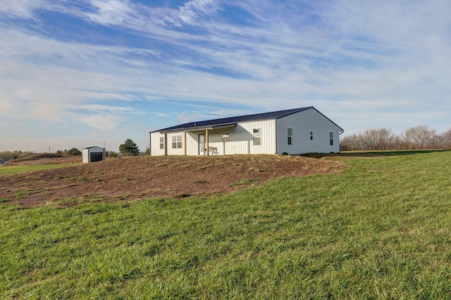 exterior space with an outbuilding and a yard