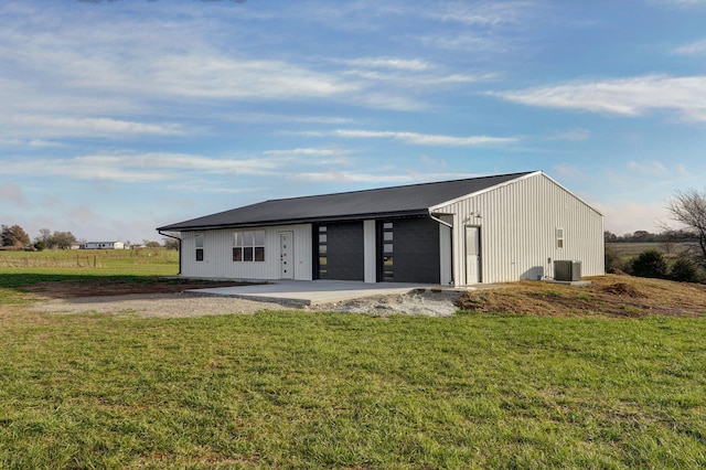 exterior space featuring a lawn and cooling unit