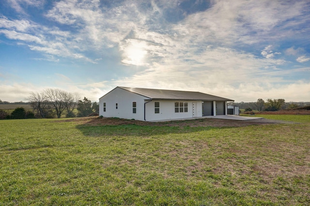 rear view of house with a lawn