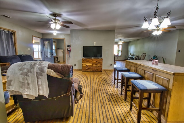 living room featuring a notable chandelier