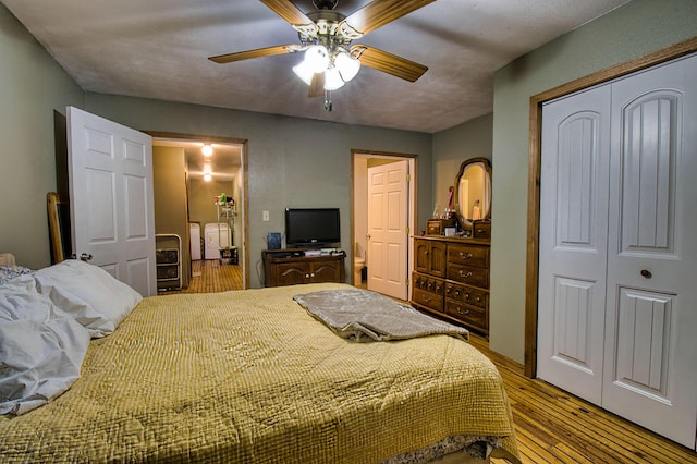 bedroom featuring hardwood / wood-style floors and ceiling fan