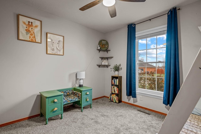 game room with carpet flooring and ceiling fan