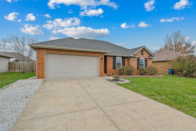 single story home featuring a garage and a front lawn