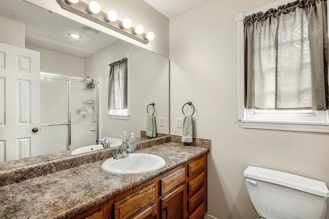 776 S Pinehurst St, Nixa, MO 65714 - bathroom featuring a shower stall, toilet, and vanity