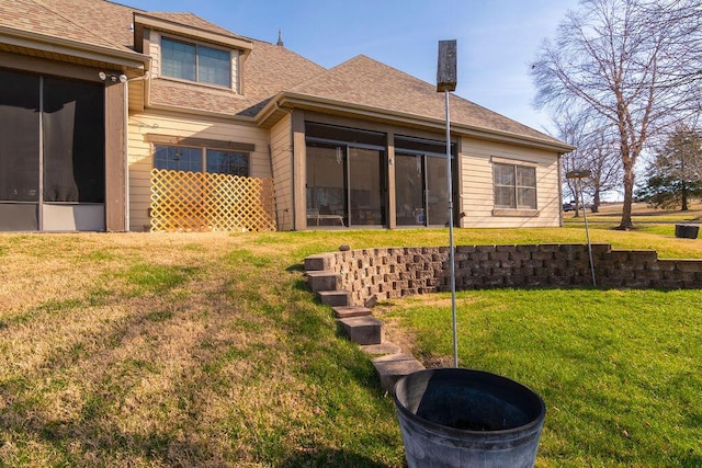 back of house featuring a yard