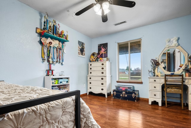 bedroom featuring dark hardwood / wood-style flooring and ceiling fan