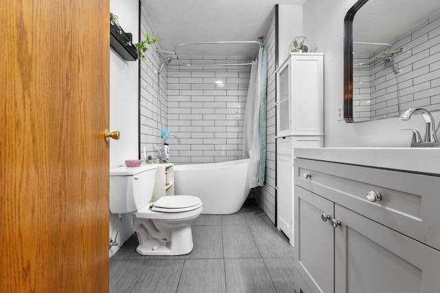 full bathroom with shower / bath combination with curtain, tile patterned floors, vanity, a textured ceiling, and toilet