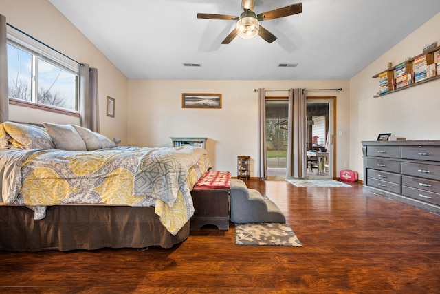 bedroom featuring ceiling fan, dark wood-type flooring, and access to outside