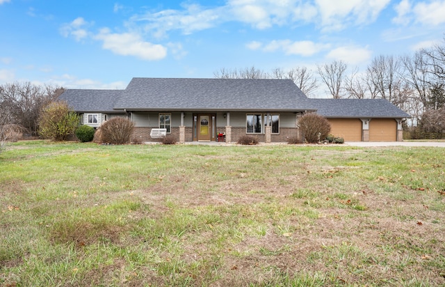 ranch-style home featuring a garage and a front lawn