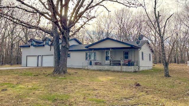 view of front of property with covered porch and a front lawn