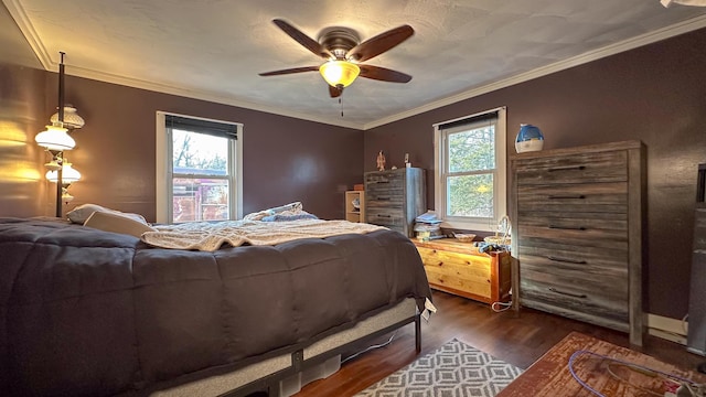 bedroom featuring ceiling fan, dark hardwood / wood-style floors, and ornamental molding