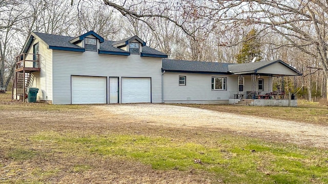 view of front of home featuring covered porch and a garage