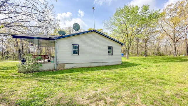 view of property exterior with a yard