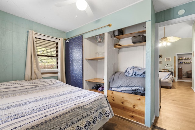 bedroom featuring ceiling fan and wood-type flooring