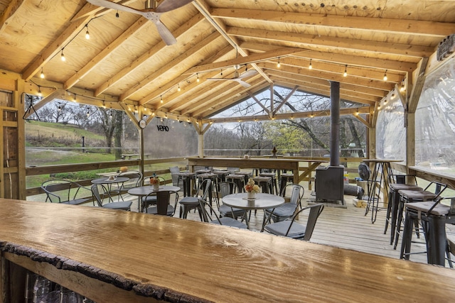 wooden terrace with an outdoor bar