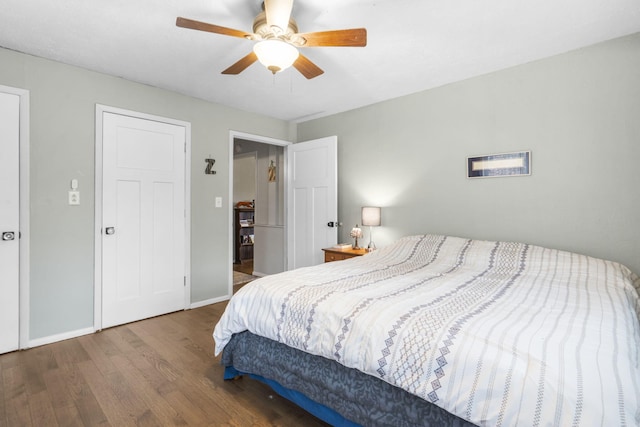 bedroom featuring wood-type flooring and ceiling fan