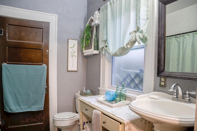 bathroom with sink and toilet