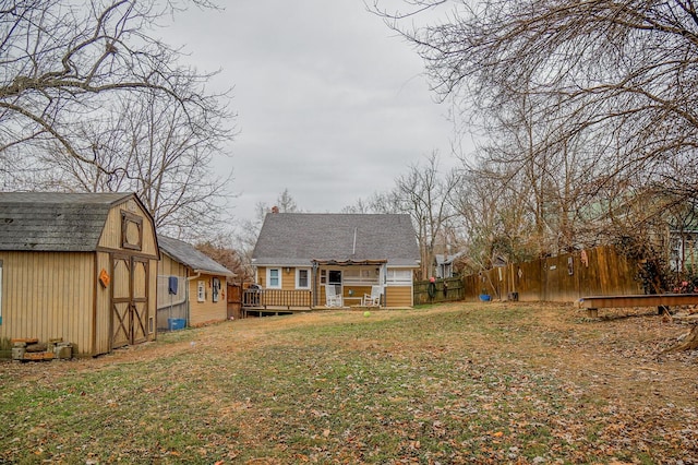 view of yard with a storage unit and a wooden deck