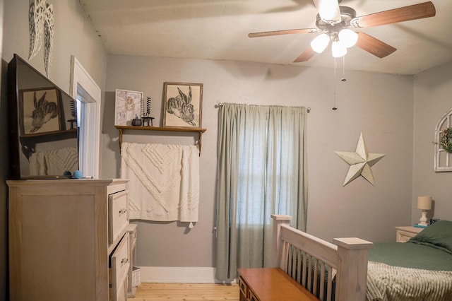 bedroom featuring light wood-type flooring and ceiling fan