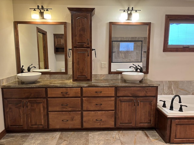 bathroom featuring a tub and vanity