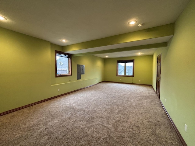 carpeted empty room with electric panel