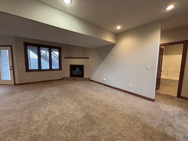 unfurnished living room featuring carpet flooring