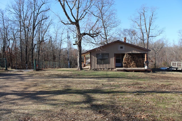 view of side of property featuring a yard