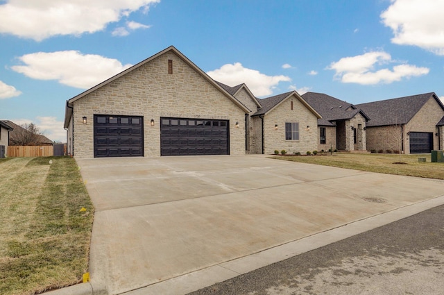 french country home featuring a front yard, a garage, and central AC unit