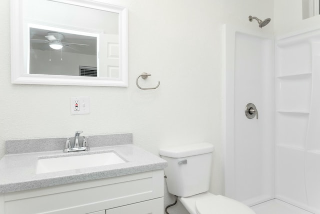 bathroom with vanity, toilet, and walk in shower