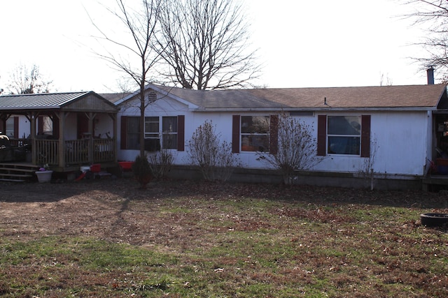 ranch-style house with a front lawn