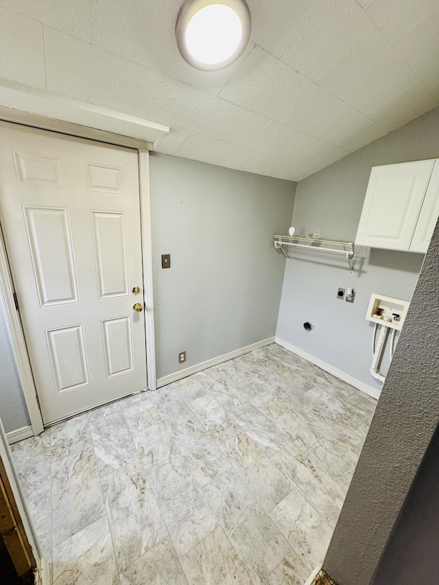 laundry area featuring hookup for a washing machine, cabinets, and hookup for an electric dryer