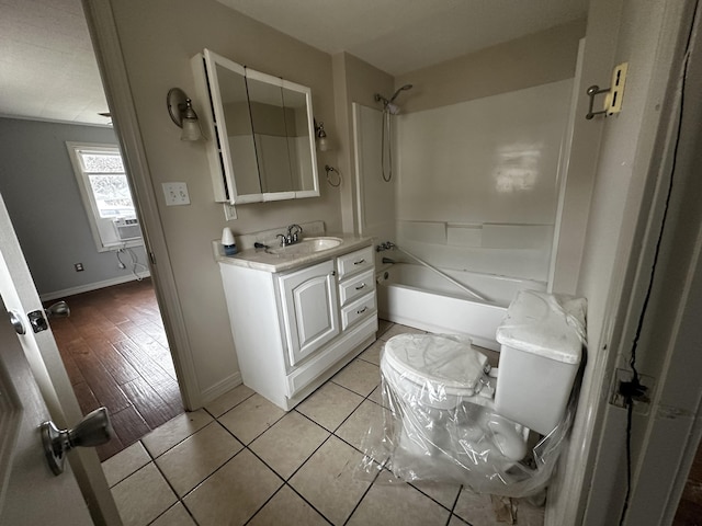 full bathroom featuring vanity, bathtub / shower combination, tile patterned floors, cooling unit, and toilet