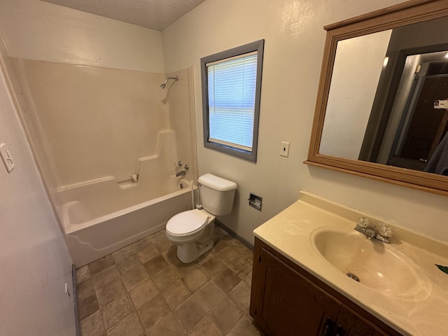 full bathroom featuring shower / tub combination, vanity, a textured ceiling, and toilet