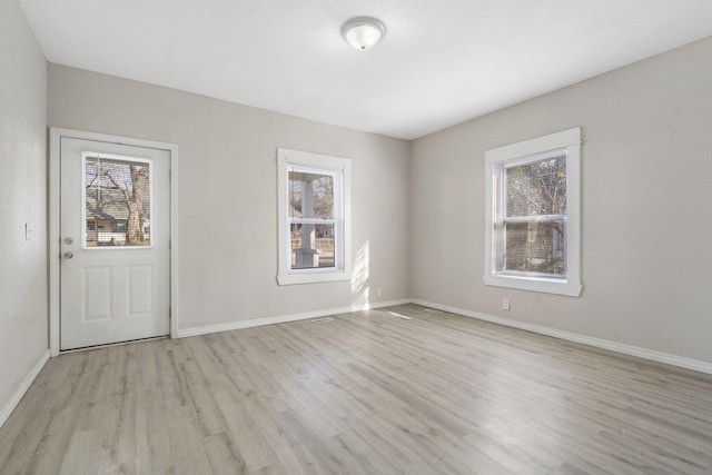 empty room with light wood-type flooring