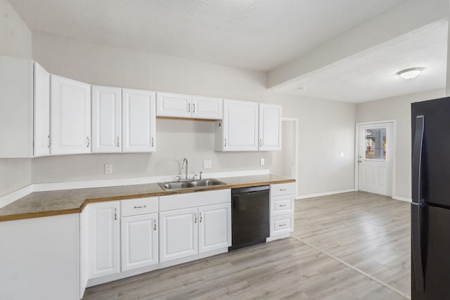 kitchen featuring light wood-type flooring, sink, white cabinetry, and black appliances