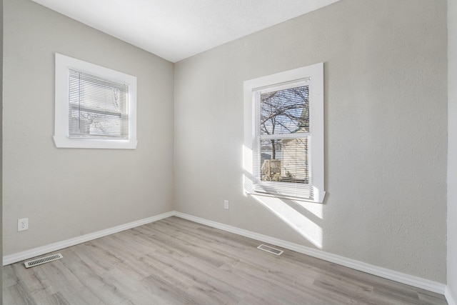 empty room featuring light hardwood / wood-style floors