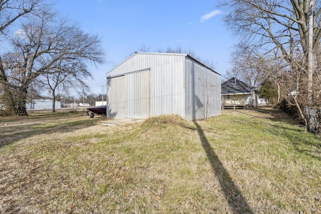 view of outbuilding with a lawn