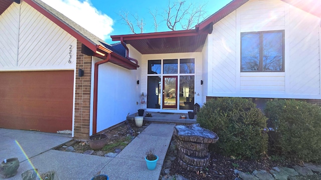 view of exterior entry featuring a garage